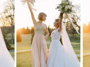 Two women in formal dresses, one in a wedding gown, holding bouquets and smiling at sunset on a golf course.