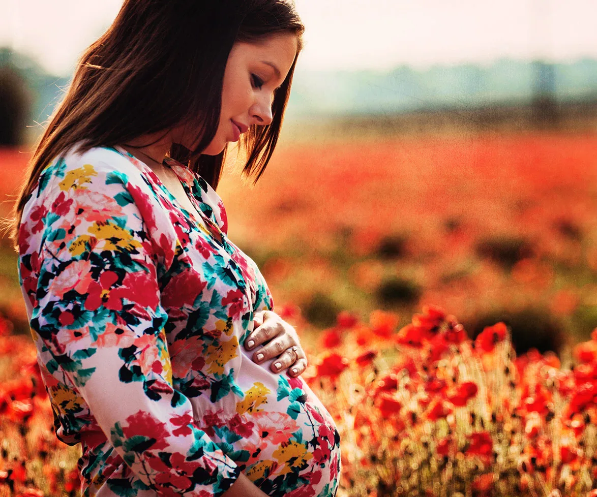 Pregnant woman holding her belly