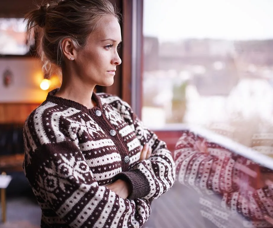 Woman staring out window