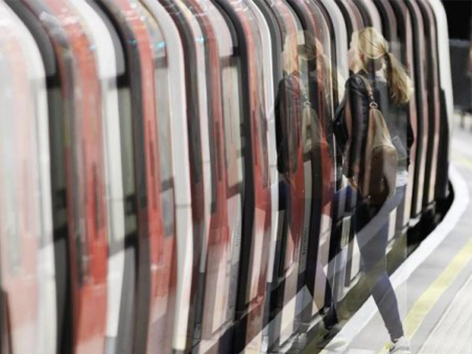 A person boards a train with motion blur, emphasizing the sense of anxiety while using public transport.