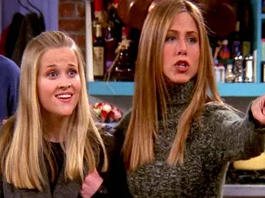 Rachel and Jill Green in a kitchen setting, with Rachel pointing and Jill looking surprised.
