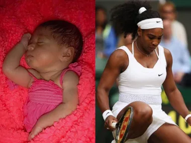 A sleeping baby in pink next to a tennis player in white attire on a court.
