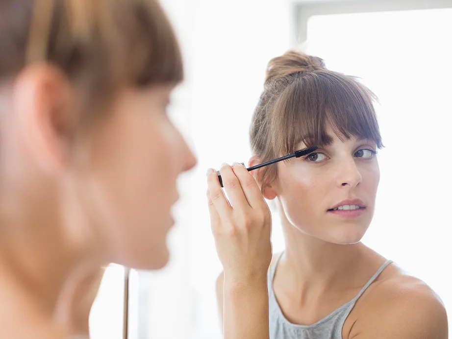 Woman applying makeup