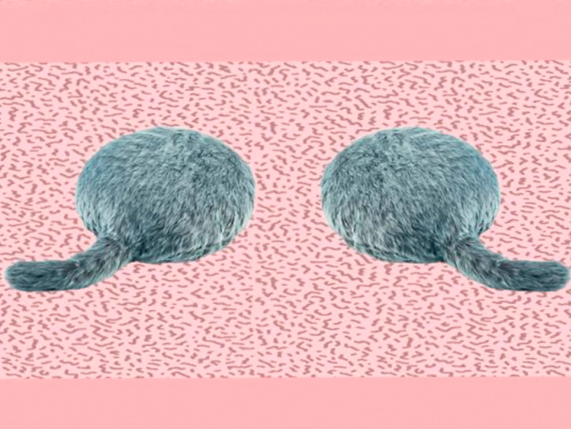 Two round, fluffy robot cat cushions with tails on a pink background with scattered patterns.