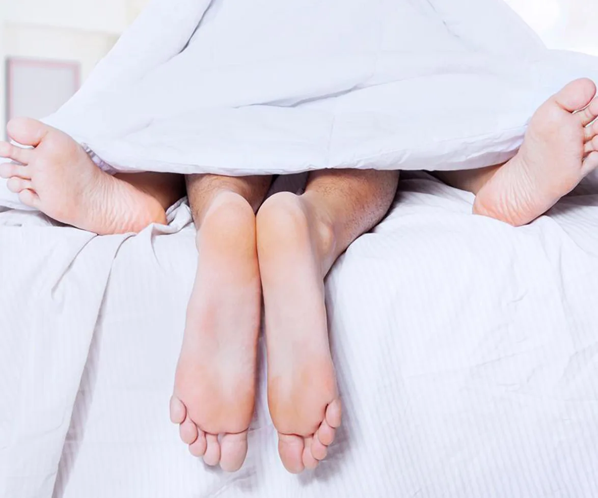 Man and woman in bed.