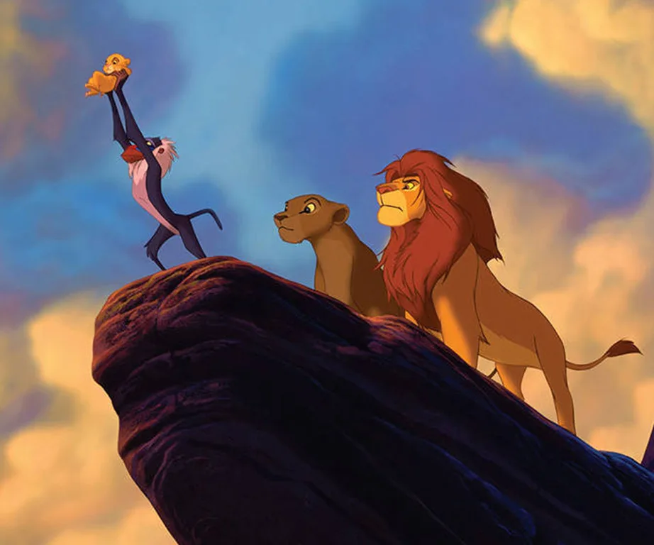 Rafiki holds up Simba on Pride Rock, with Mufasa and Sarabi beside him, from "The Lion King" animated film.