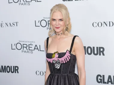 Actress in a stylish dress with vibrant design at Glamour Awards 2017 red carpet.