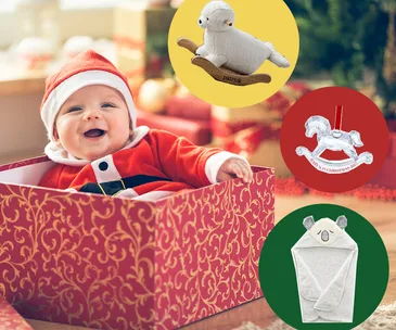 Baby in Santa outfit in a festive box with toy ideas: rocking lamb, crystal rocking horse, and koala towel.