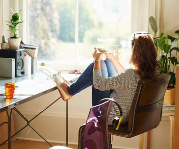 Woman staring out window