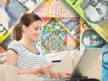 Woman shopping online with laptop and credit card, background of Australian dollar bills.