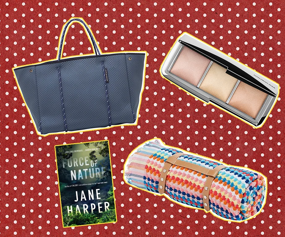 Gifts for a new mum: a blue bag, makeup palette, "Force of Nature" book, colorful blanket on red polka dot background.