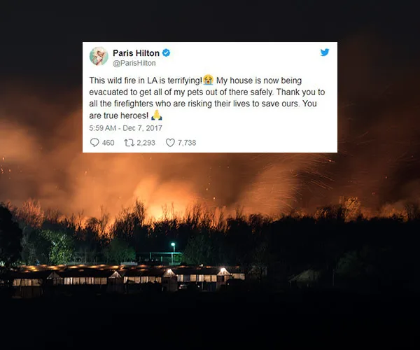Paris Hilton's tweet about California wildfires with an image of a large fire behind trees and buildings at night.