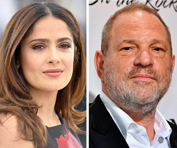 Salma Hayek and a man at a formal event, both facing the camera.