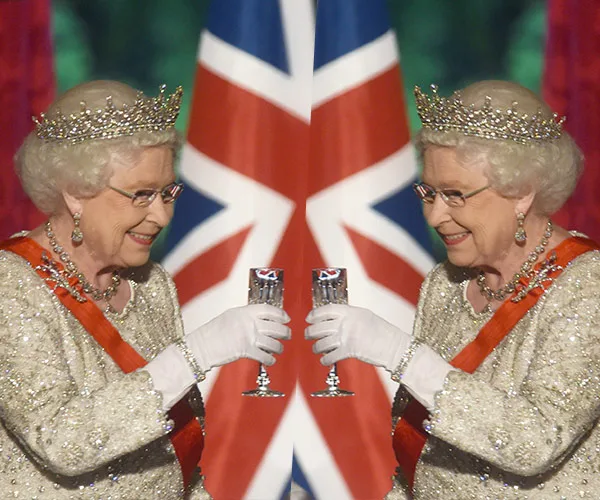 Two mirrored elderly women in tiaras toasting with glasses, Union Jack backdrop.