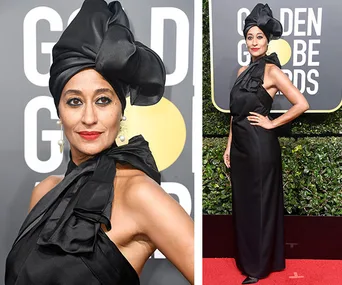 Actress in a black gown and headwrap at Golden Globes, wearing red lipstick and pearl earrings on the red carpet.
