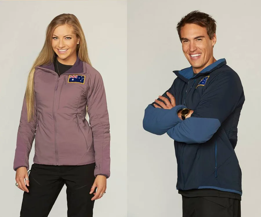 Australian contestants smiling in jackets with flags on "The Bachelor Winter Games."