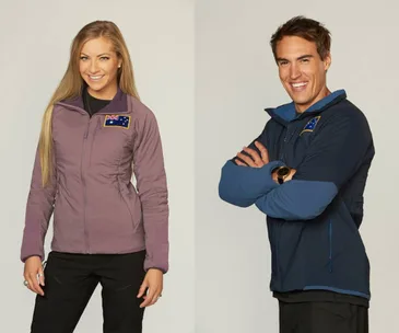 Australian contestants smiling in jackets with flags on "The Bachelor Winter Games."