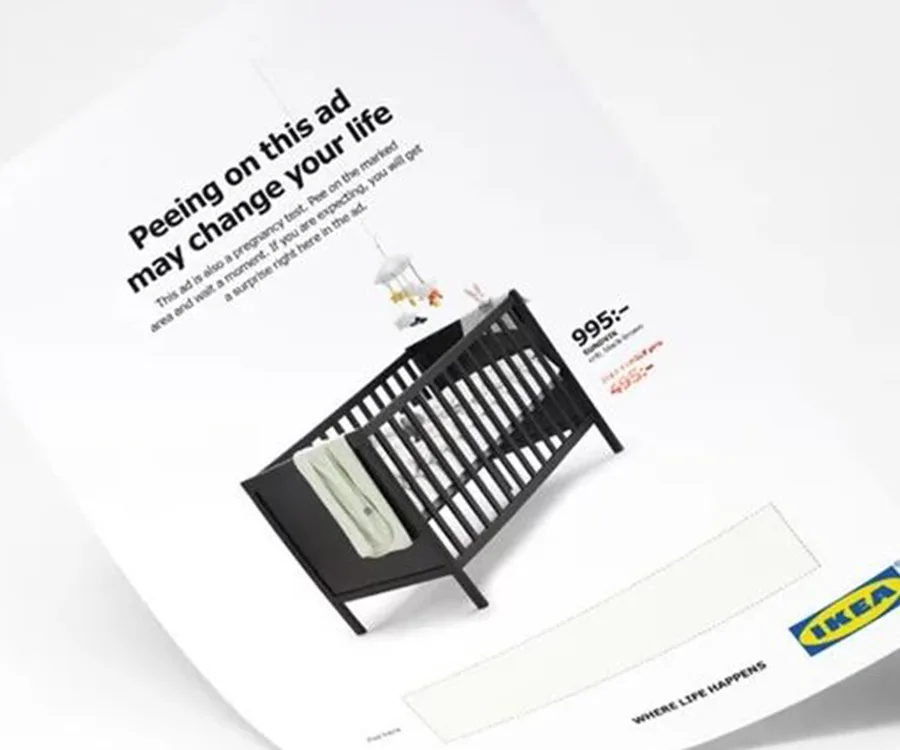 Ad promoting IKEA crib as a pregnancy test, featuring discount message; suggests peeing to reveal offer price.