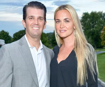 I don't know who they are, but this image shows a smiling couple outdoors with greenery in the background.