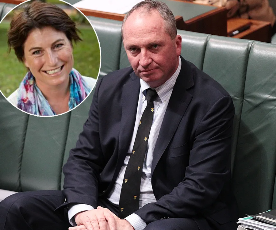 Man in a suit sitting on a green bench, with an inset of a smiling woman in a colorful scarf.