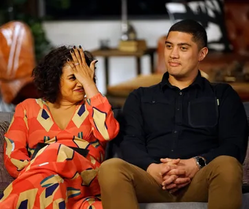 Charlene laughs, covering her face, sitting beside Patrick on a couch, from "Married at First Sight".