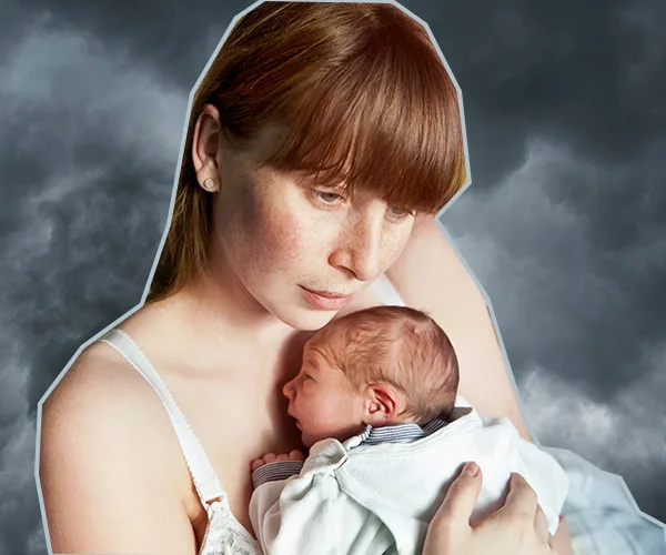 Woman holding newborn against a stormy sky background.