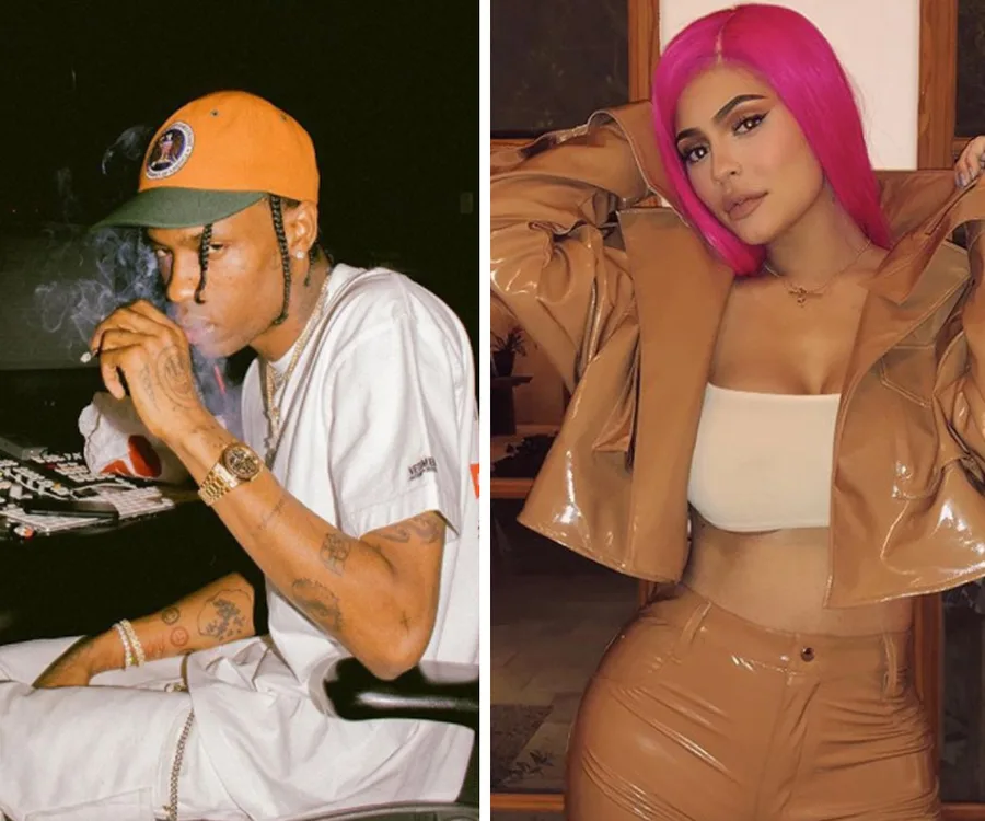 Man sitting, wearing a cap, and woman posing in a pink wig and brown outfit.