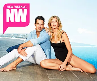 A couple posing by a pool with an ocean view, one in a black swimsuit, under a "New Weekly" logo.