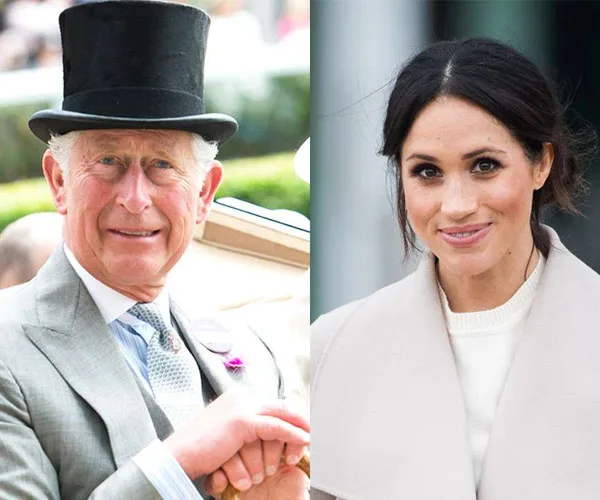 "Prince in top hat and woman smiling, standing outdoors, dressed formally."