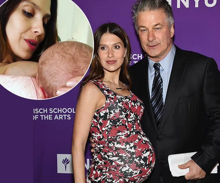 Hilaria Baldwin breastfeeding her newborn son, with Alec Baldwin beside her at an event.