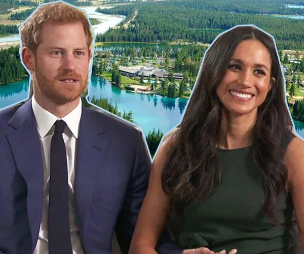 "Couple smiling with forest and lake background, suggesting a serene, picturesque honeymoon destination."