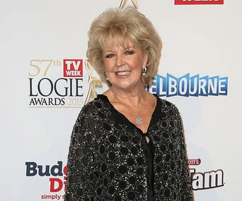 Patti Newton at the 57th TV Week Logie Awards 2015, wearing a patterned black outfit and smiling.