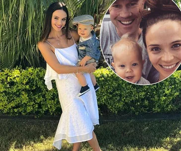 Woman in white dress holding a toddler in a garden; inset shows smiling family selfie with baby.