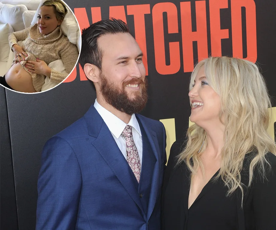 Couple smiling at red carpet event; inset shows woman on couch holding pregnant belly.
