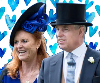 Two people in formal attire with hats, smiling, in front of a background with blue hearts.