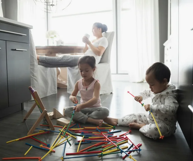Simple Ways To Occupy The Kid: Mother enjoying a coffee while children play