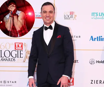 Man in formal attire at the 60th Logie Awards 2018, with a circular inset of a singer performing on stage.