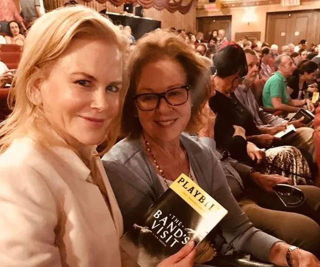 Nicole Kidman with her mom, holding a playbill for "The Band's Visit" in a theater.