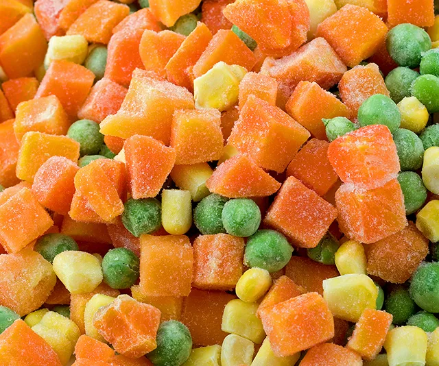 Frozen mixed vegetables with carrots, corn, and peas shown closely.