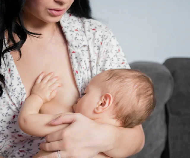 Woman breastfeeding baby
