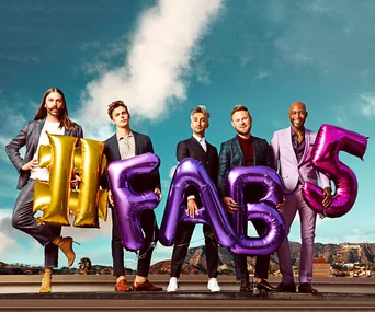 The Fab Five from "Queer Eye" holding colorful letter balloons spelling "#FAB5" with a Hollywood backdrop.
