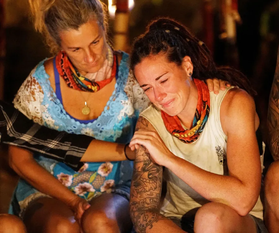 Two Survivor contestants, one in tears being comforted by another, on Survivor Australia 2018.
