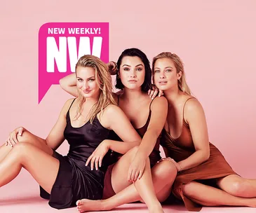 Three women in satin dresses pose against a pink background, with "New Weekly" magazine logo displayed in the top left.