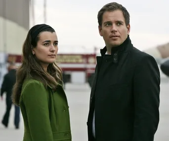 Michael Weatherly and Cote de Pablo as Tony DiNozzo and Ziva David standing outdoors in NCIS scene.