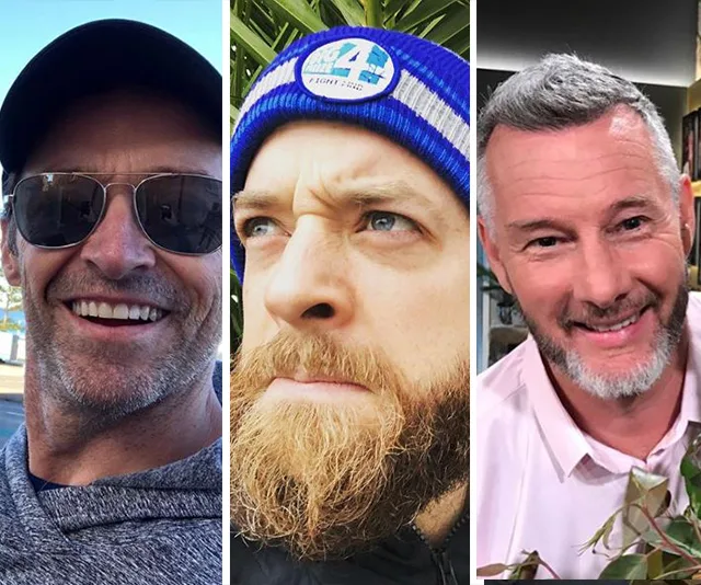 "Three men with beards; one in sunglasses, one with a beanie, and one in a white shirt smiling."