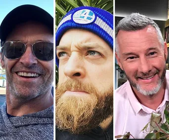 "Three men with beards; one in sunglasses, one with a beanie, and one in a white shirt smiling."
