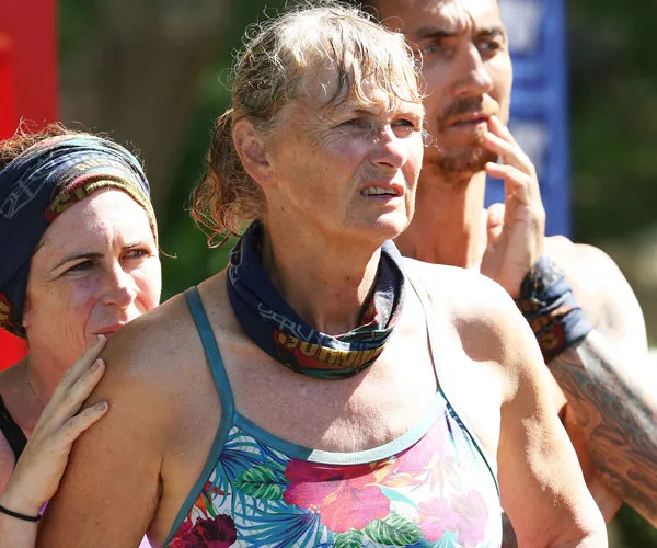 People with intense expressions wearing buffs, likely during a competition on Australian Survivor 2018.