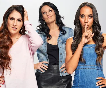 Three women posing; one looks confused, another pensive, and the third is gesturing for silence.