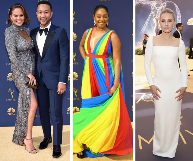 Chrissy Teigen in silver gown, John Legend in tux, a woman in rainbow dress, and another in white gown at 2018 Emmys.