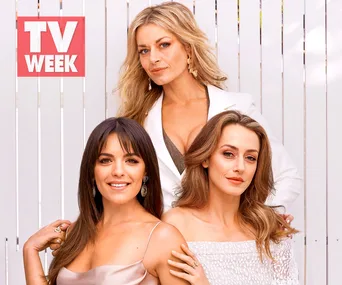 "Three women from TV series 'Playing For Keeps' pose in glamorous outfits beside a 'TV WEEK' logo against a white backdrop."